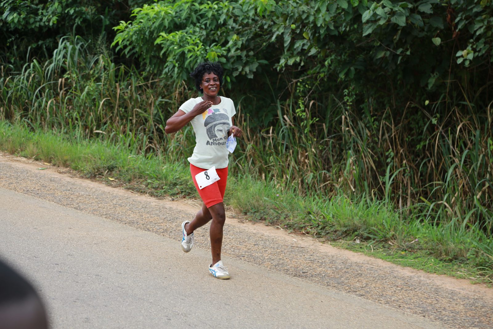 A runner flying solo down the road