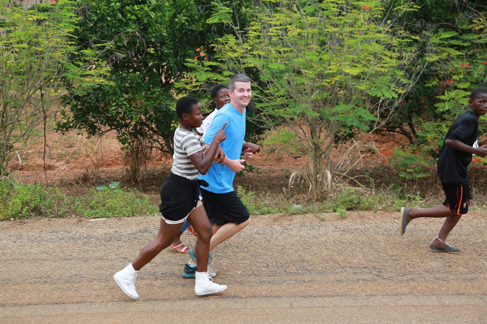 Two runners sprinting on the dirt