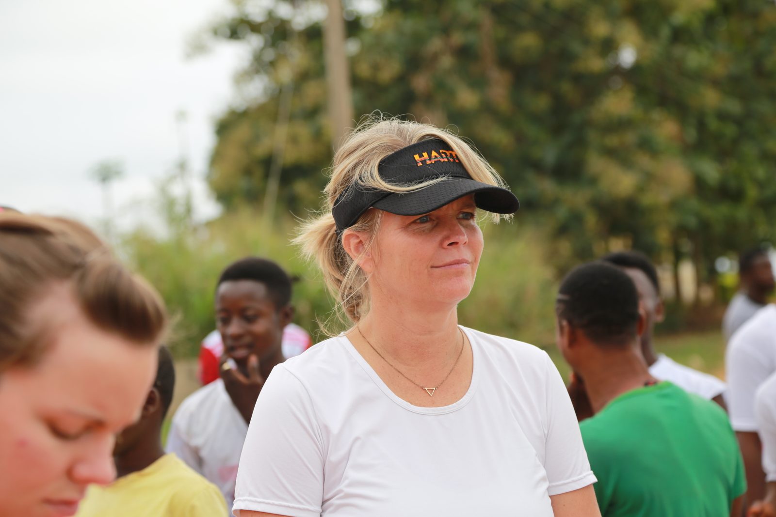 A volunteer in a HART visor amid the race day crowd