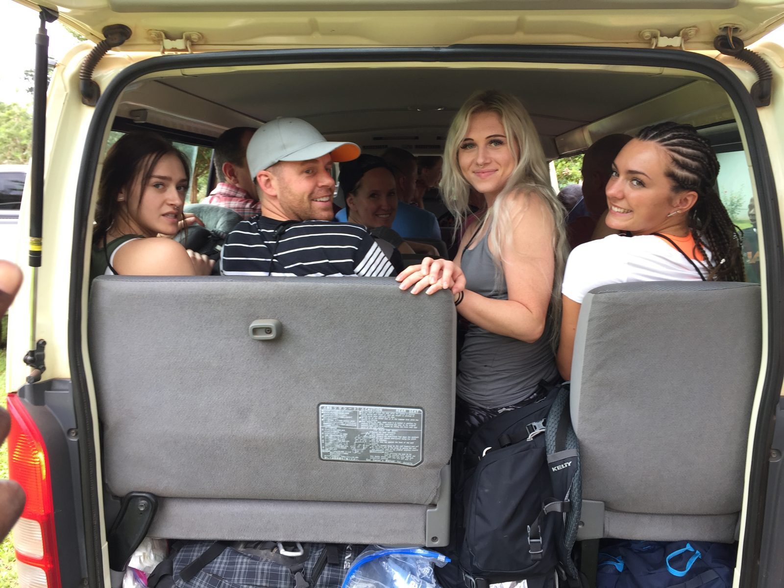 Volunteers packed into the mission van with luggage