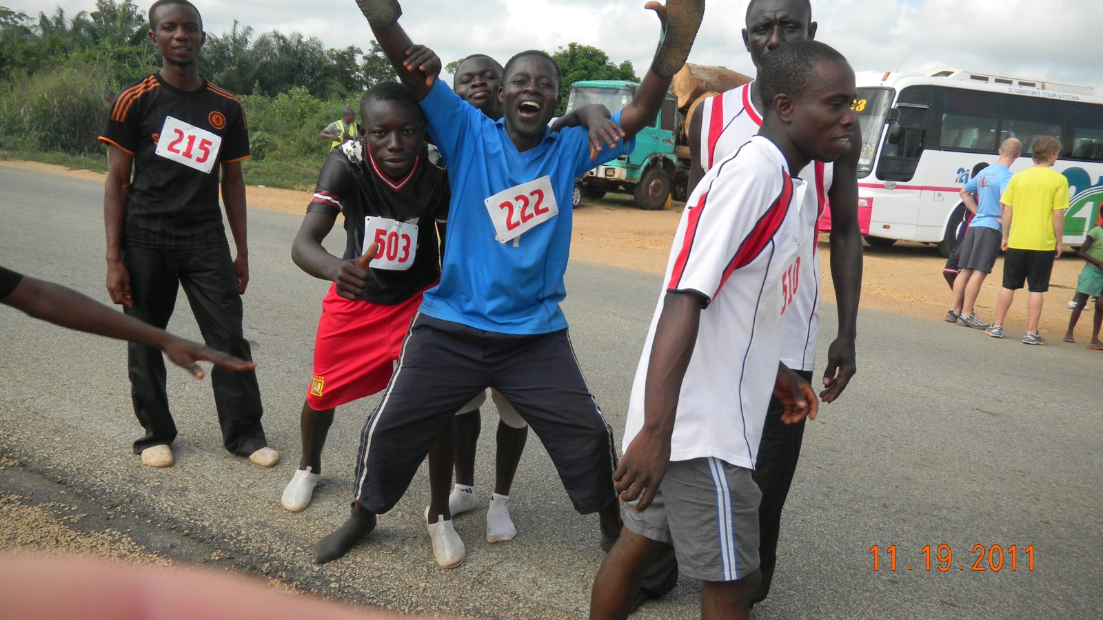 The crowd cheers runners along the road